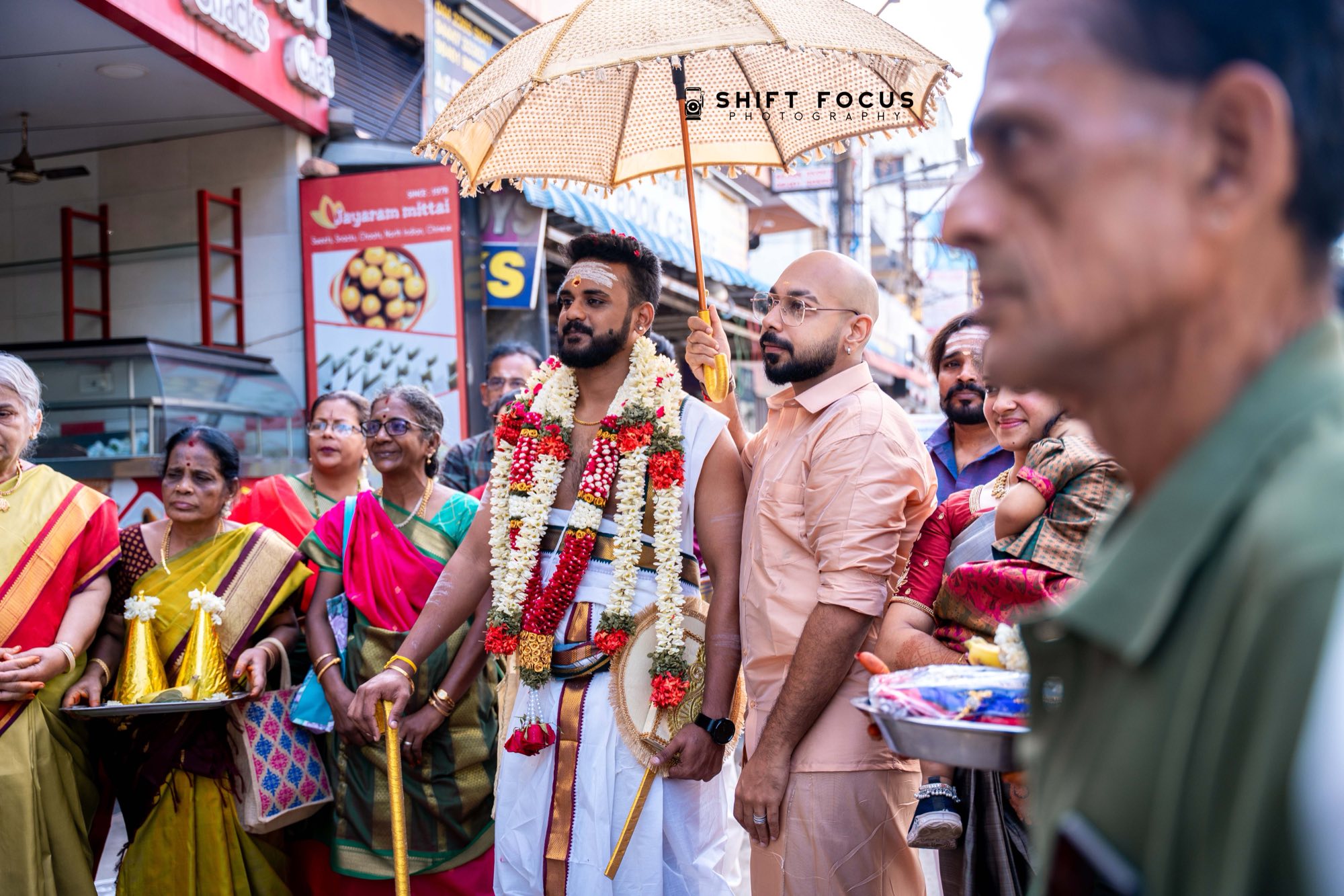 Wedding procession under the temple umbrella