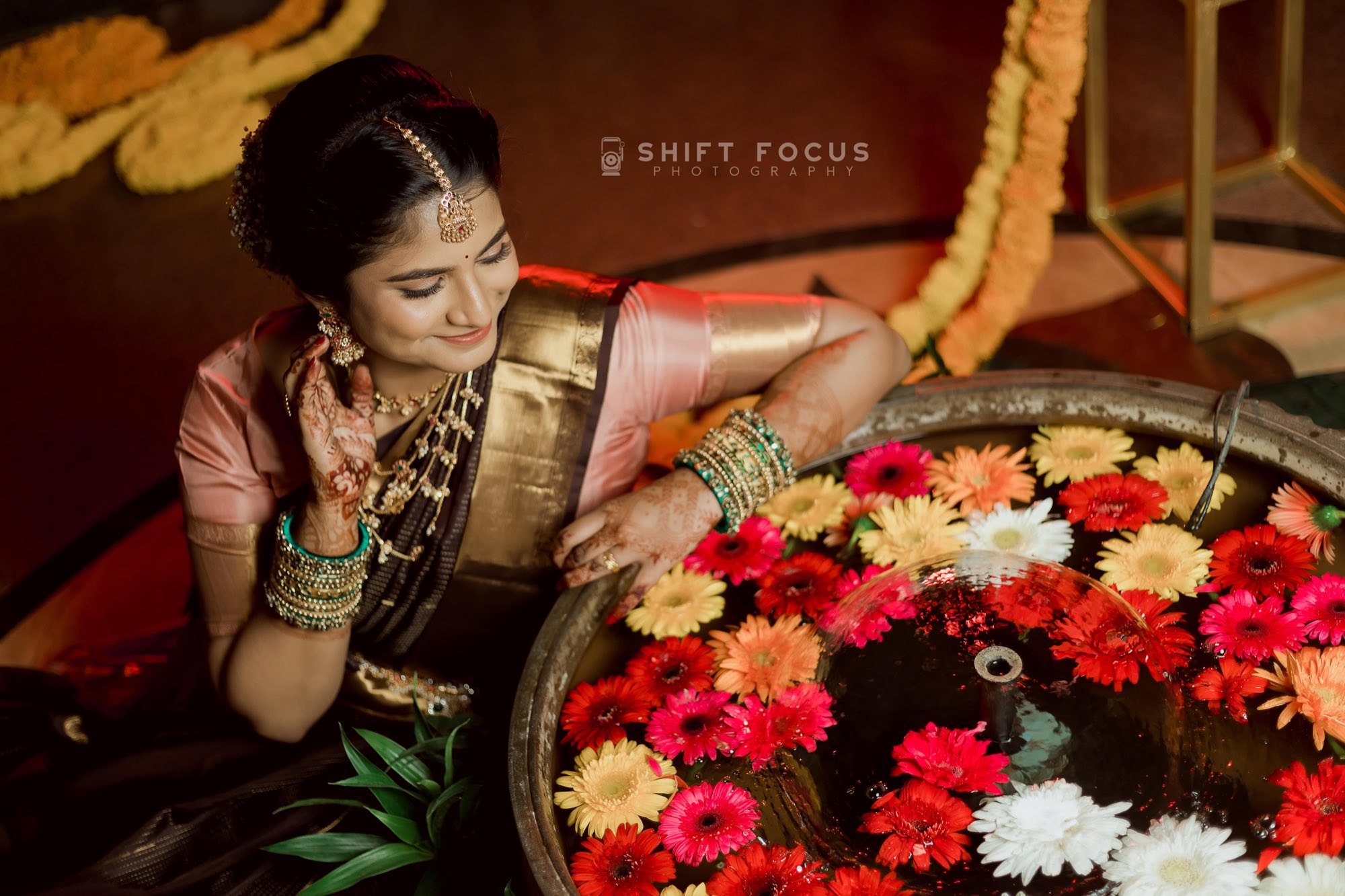 Bride with a tray of flowers