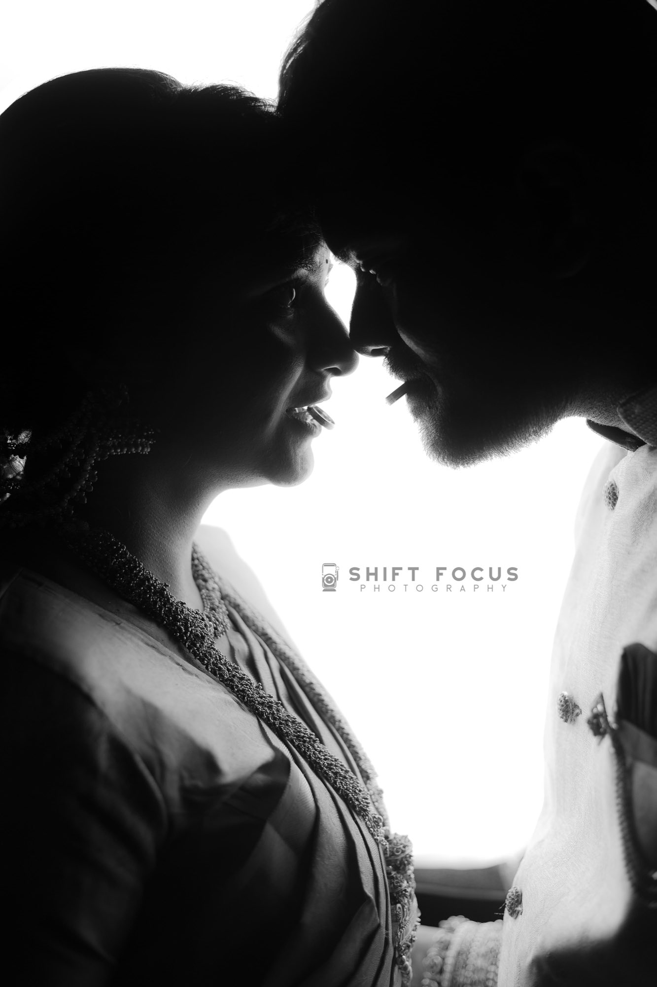 Silhouette of the couple about to kiss