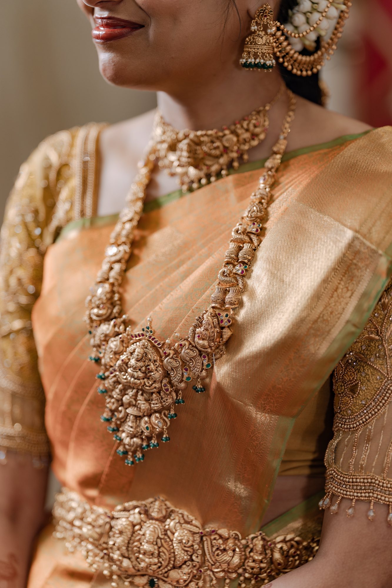 Bridal gold jewelry over a silk saree